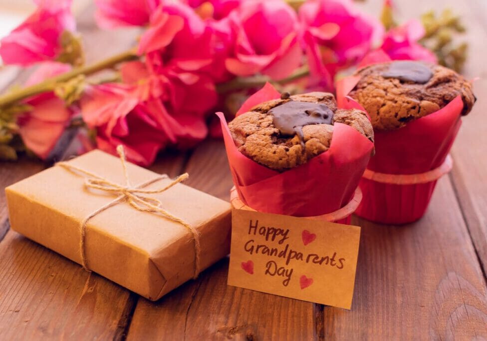 Lovely card with red mallow flowers and two muffins and box and craft tag. Grandparents day.